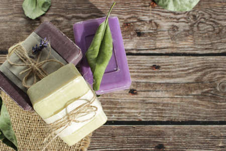 soap of light shades from natural ingredients on a wooden surfaceの写真素材