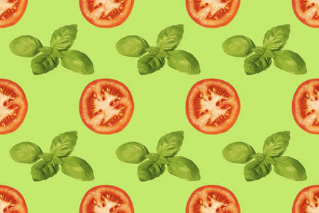 Seamless pattern of tomato slices and basil leaves on a green background. A simple drawing for the surface of packaging, textiles.の写真素材