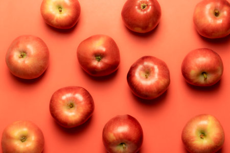 Red apples on a red background.の写真素材