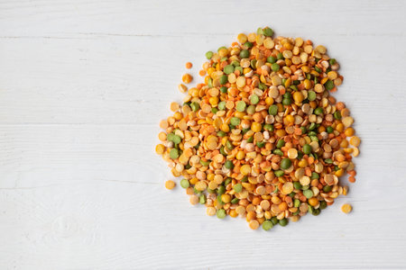 Dry peas of different colors close-up on a light background. Layout for grocery departments, poster,...