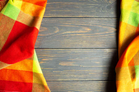 Colored linen towel on a gray wooden background with space for text. Layout.の写真素材