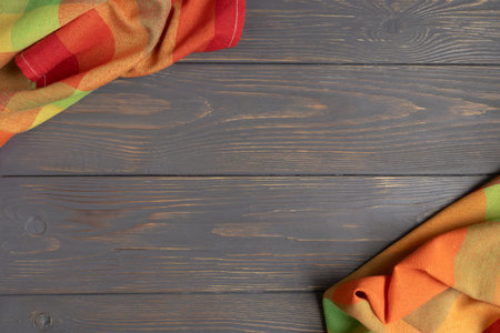 Colored linen towel on a gray wooden background with space for text. Layout.の写真素材