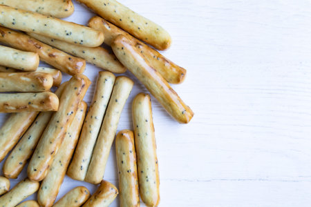 Sticks with poppy seeds on a white background with space for text. Packaging.