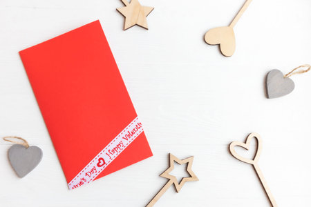 Valentines Day accessories from natural materials and an envelope on a white background with space...
