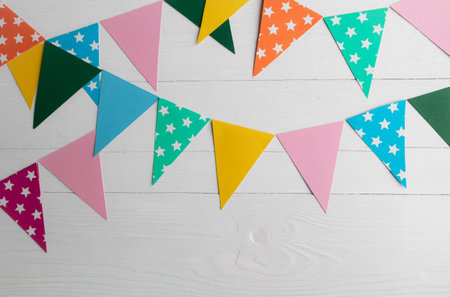 A garland of multicolored flags on a white background with space for your text.Holiday Templateの写真素材