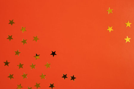 Red background with red and white asterisks with place for text in the center. Banner, poster.の写真素材