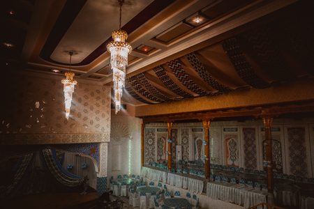 Traditional Uzbek restaurant with honatlas textile in Old Bukhara town, Uzbekistanのeditorial素材