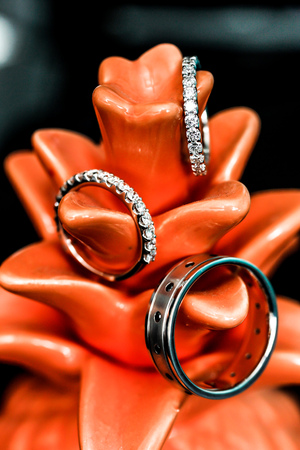 three wedding rings on black two squaresの写真素材