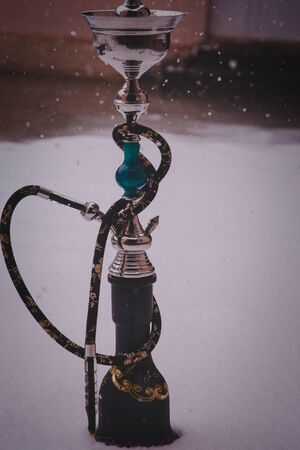 Big hookah for tobacco smoking made of metal, glass and ceramics.の写真素材