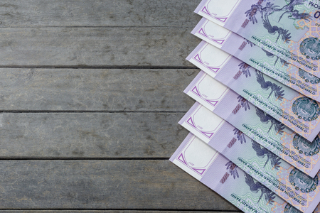 Uzbek banknotes on wooden background. Currency. Uzbek Money. Fifty Thousand Uzbek Sums 50000の写真素材