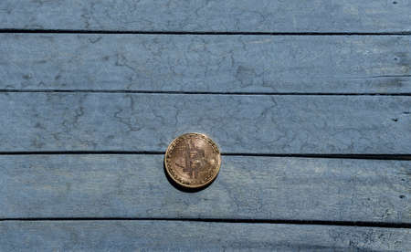 Bitcoin coin on dark wooden desk backgroundの写真素材
