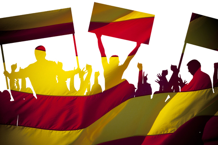 Silhouettes of protesting people against the the flag of Barcelona on white background. Isolated. People are on strike. Independence of the catalonia. Departure from Spain. A crisis. Barcelona, Spain.の写真素材