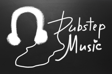 Dubstep music text and Drawn witch chalk earphones on blackboardの写真素材