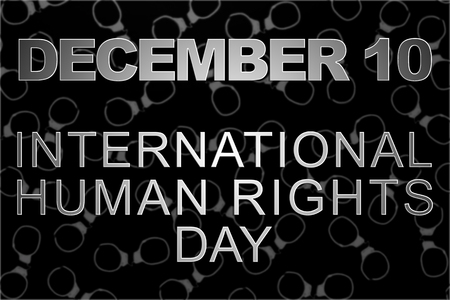 Human rights concept: handcuffs and the text: Human rights day written with chalk on blackboard.の写真素材