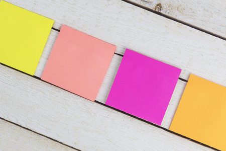 Paper stickers note on wooden table backgroundの写真素材