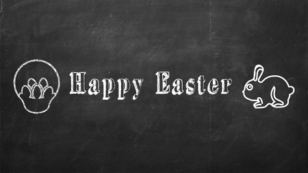 Happy easter inscription written on black chalkboardの写真素材