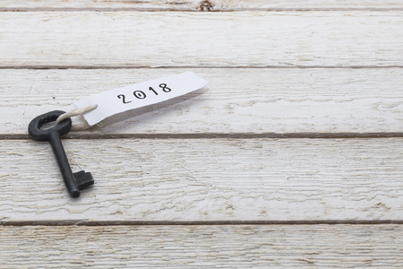 Business concept - Old key vintage on wood with tag 2018.の写真素材