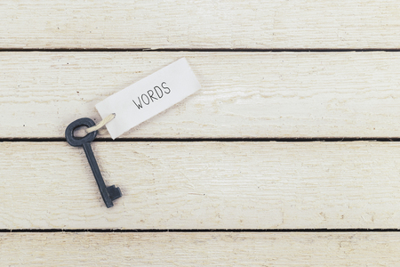 Keys to words - Keychain over white Wooden Background. Top View.の写真素材