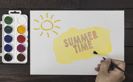 summer time concept. Artist's hand with a brush paintingの写真素材