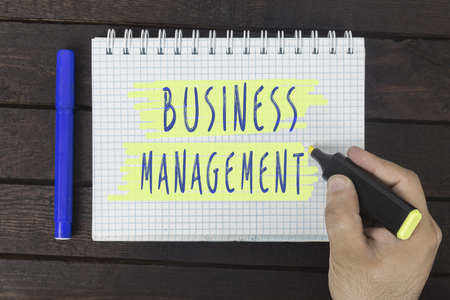 business concept. hand writing on notepad: Business managementの写真素材