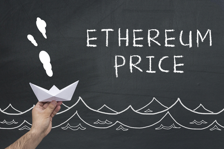 Ethereum price and hand with paper boat against chalkboard.の写真素材