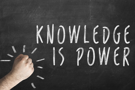 fist and inscription knowledge is power on chalkboardの写真素材