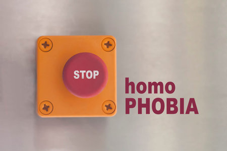 stop homophobia concept image. Industrial switching button with text: stop homophobia