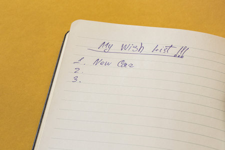 Notebook with wish list. Wonder list of person. New plans for new year