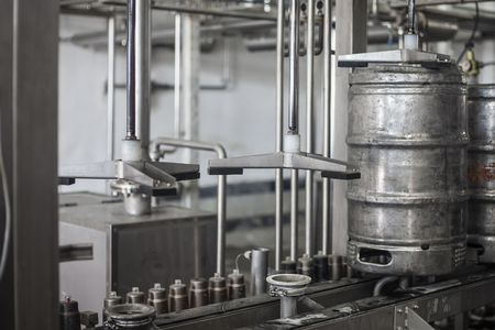 Beer kegs on the production line in the factoryの写真素材