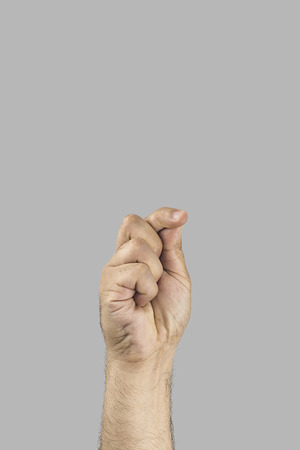 Man's hand trying to hold something, isolated photoの写真素材