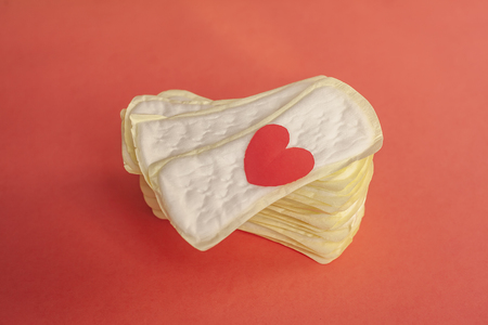 Feminine hygiene pads on the red backgroundの写真素材