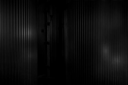 Metal corrugated background with free space for text. Gray wavy grooved metal texture, copy spaceの写真素材