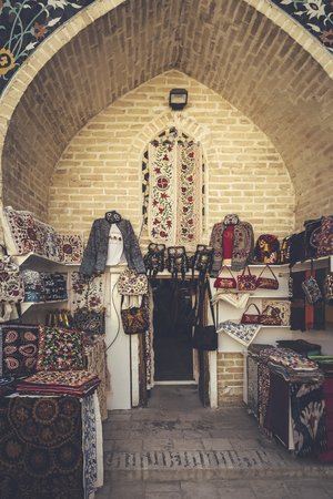 Bukhara, Uzbekistan - March 13, 2019: Outdoor street shops inside of Nadir Divan-begi Madrasah. Part of the architectural complex located round well-known Lyabi-Hauz in Bukhara, Uzbekistanのeditorial素材