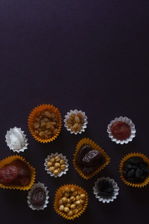 Eid Mubarak. Different iftar sweets. Celebrating Eid Al Adha. Islamic traditional holiday. Eid al-Fitr. Holly Ramadan. Middle East religious holiday. Iftar table decorated dried date fruit and sweets.の写真素材