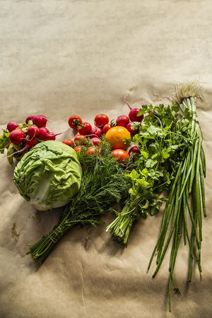 Healthy food background. Assortment of fresh vegetables on paper background. Copy space.の写真素材