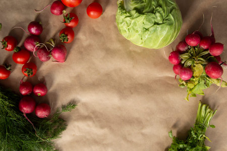 Healthy food background. Assortment of fresh vegetables on paper background. Copy space.