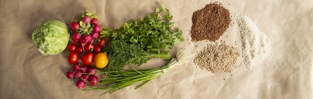 Healthy food background. Assortment of fresh vegetables on paper background. Copy space.の写真素材