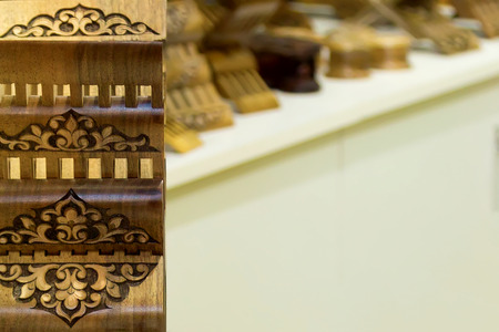 Store of ingenious rihals. Wooden book stands in Bukhara, Uzbekistan. Holly Quran Kuran Koran book holder stands shop. Beautiful works of art, carved from a single piece of woodの写真素材
