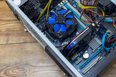 Opened PC computer case and a wrench.