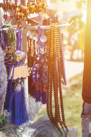 Tasbeeh Tasbih beads. Muslim Prayer Beads. Selling tasbeehs. Open air market trading with prayer beadsの写真素材