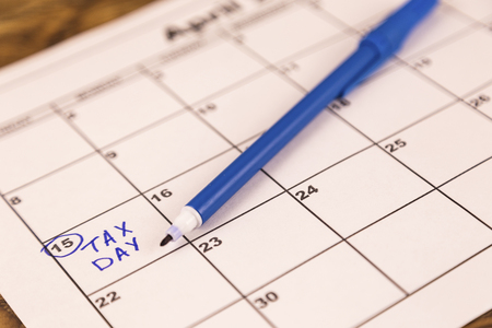 concept for tax day or april 15 the national deadline for filing taxesの写真素材
