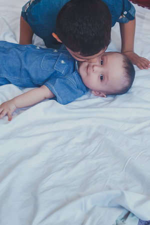 Happy childhood concept. Happy brothers portrait. 6 years and 6 months old boys having fun. Two...