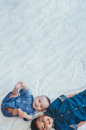 Happy childhood concept. Happy brothers portrait. 6 years boy and 6 months old baby boy having fun....