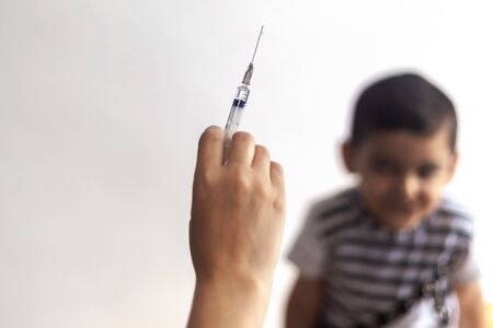 A doctor vaccinating young patient. Little boy scared of injection. Child's Immunization, Children's Vaccination, Health conceptionの写真素材