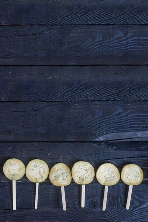 Sliced eggplants with sticks on dark rustic wooden backgroundの写真素材