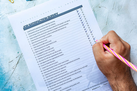 Person filling the Employee Satisfaction Survey. Blank Job Satisfaction Survey on bright background