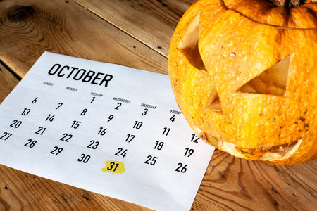 Halloween concept. October calendar with - October 31 Halloween day marked and Pumpkin - Jack-o'-lanternの写真素材