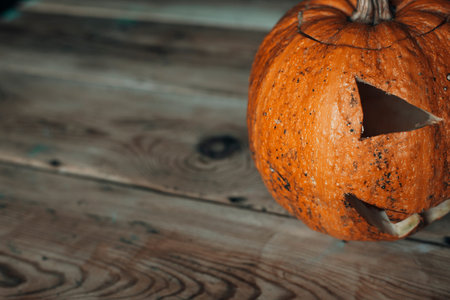 Halloween Pumpkin jack lantern on wood. Copy space