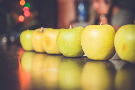 A row of green apples during Xmas partyの写真素材
