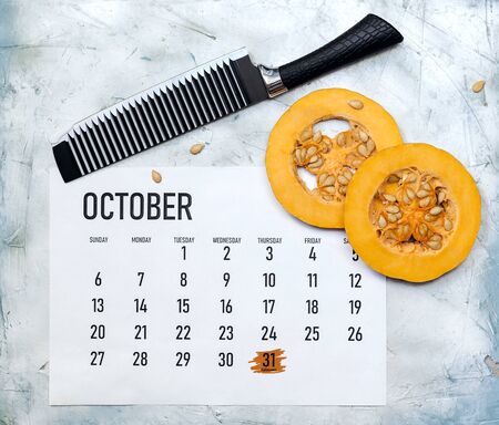 Fall concept. October 2019 Paper Calendar with round slices of pumpkinの写真素材